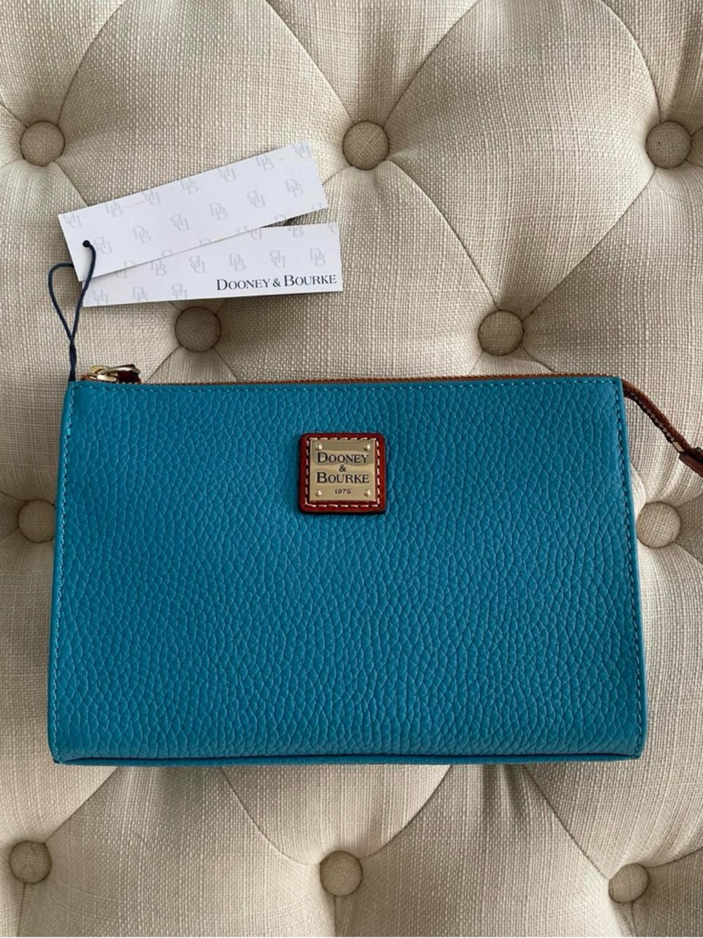 Dooney & Bourke Turquoise Pebbled Leather Wristlet with Gold Logo